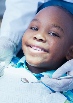 Child smiling at dental checkup