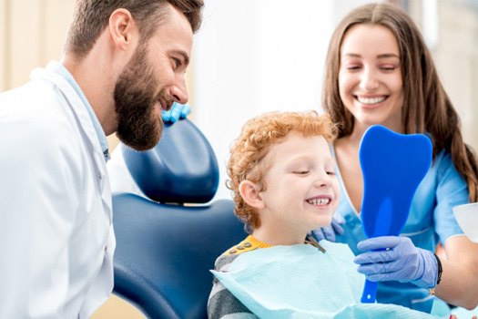 Boy smiling at the dentist