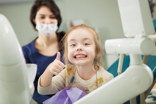 Girl smiling at the dentist