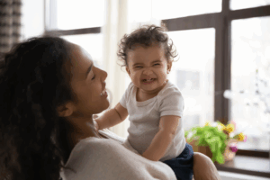 a child and their parent smiling